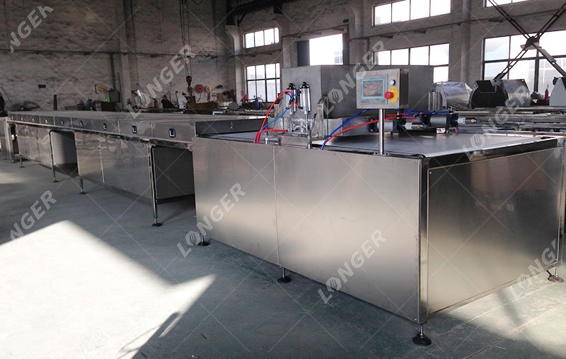 máquin depositador de gotas de chocolate